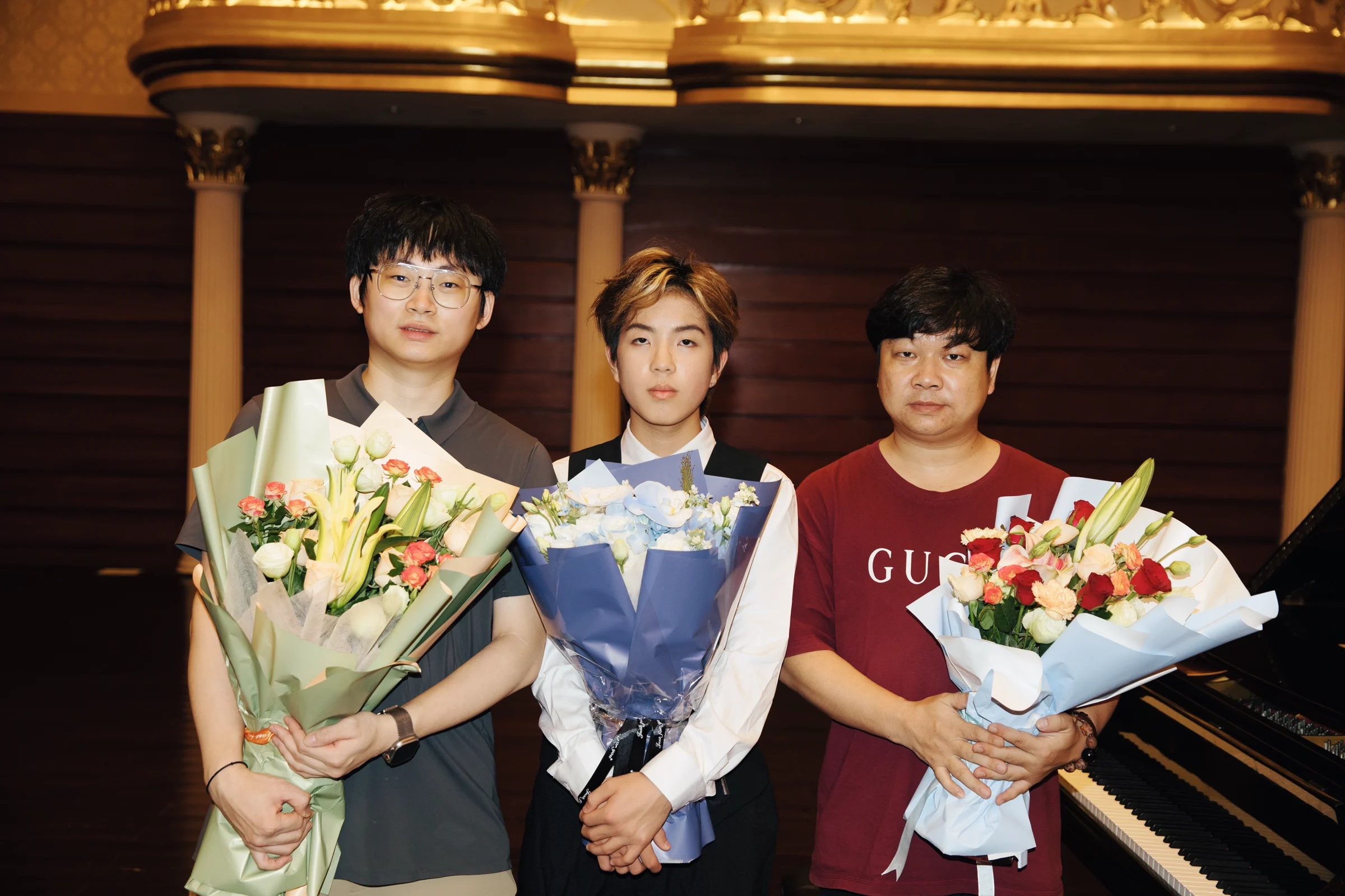 Three-person group photograph after the performance